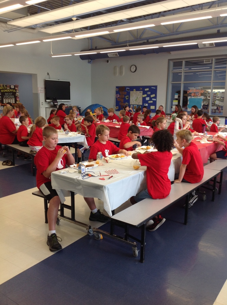 Students and staff wearing their red Save the Children t-shirts.